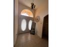 Welcoming foyer features double doors and transom window, providing ample natural light at 15011 Sw 61St Court Rd, Ocala, FL 34473