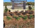 Emerson Pointe neighborhood sign with attractive landscaping and a welcoming entrance, enhancing curb appeal at 2894 Ne 21St Court Rd, Ocala, FL 34470