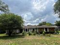 Charming single-story home with stone accents and mature landscaping in a well-maintained front yard at 9850 Sw 191St Ave, Dunnellon, FL 34432