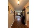 Welcoming hallway leading to the living areas with attractive flooring at 9850 Sw 191St Ave, Dunnellon, FL 34432