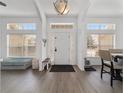 Bright foyer with modern flooring, transom windows, and views of the main living area at 15 Sunrise Dr, Ocala, FL 34472