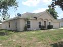 Well-maintained single-story home with tidy front yard and attached two-car garage at 1754 Sw 160Th Pl, Ocala, FL 34473