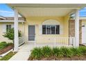 Close-up of the welcoming front porch, showcasing white railings and neat landscaping at 2158 Nw 50Th Ave, Ocala, FL 34482