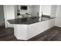 Kitchen island with granite countertop and ample storage space at 227 Fisher Run, Ocklawaha, FL 32179