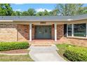 Inviting entryway with double doors and brick accents at 3950 Se 10Th Ln, Ocala, FL 34471