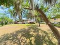 Expansive lawn and mature trees offer privacy and shade to this lovely condo community at 519 Fairways Cir # A, Ocala, FL 34472