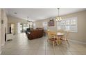 Spacious living room and dining area with tile flooring and natural light at 8617 Se 141St Street Rd, Summerfield, FL 34491