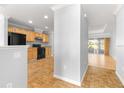A spacious kitchen seamlessly flows into a sunlit room with large windows, perfect for casual dining at 9287 Sw 91St Court Rd, Ocala, FL 34481