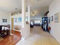 Open foyer showing tile flooring that transitions to carpeted living area and adjacent dining room at 9677 Sw 56Th Cir, Ocala, FL 34476
