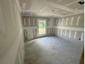 Interior view showing drywall and tape, with a window providing natural light into the room at 1057 Nw 68Th Pl, Ocala, FL 34474