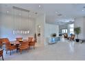 Bright and airy dining room featuring modern lighting and ample space for entertaining at 601 Se 80Th St, Ocala, FL 34480