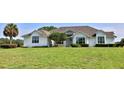 Charming single-story home with a well-manicured lawn and mature landscaping at 601 Se 80Th St, Ocala, FL 34480