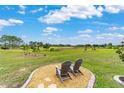 Relaxing backyard view overlooking the golf course and blue skies at 8606 Sw 61St Loop, Ocala, FL 34481