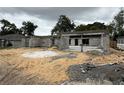 Exterior view of a house under construction showing concrete block walls, sand, and the framework of the structure at 8664 Se 162Nd St, Summerfield, FL 34491