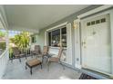 Cozy front porch with seating, offering a welcoming space to relax and enjoy the outdoors at 8784 Sw 93Rd Ln # A, Ocala, FL 34481