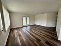 Spacious living room featuring modern flooring and a patio door at 8901 Sw 103Rd Ln, Ocala, FL 34481