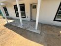 Exterior shot of front porch area with white columns and some construction work needing to be completed at 904 Nw 67Th St, Ocala, FL 34474
