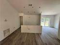 Spacious living room with modern flooring and neutral walls, ready for personalization at 904 Nw 67Th St, Ocala, FL 34474