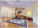 Spacious living room with a decorative rug, sofa, and recessed lighting at 9325 Sw 125Th Court Rd, Dunnellon, FL 34432