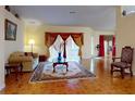 Open living room with tiled floors, ample natural light, and stylish decor at 9325 Sw 125Th Court Rd, Dunnellon, FL 34432