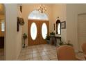 Entryway showcasing tiled flooring, double doors, and decorative accents that enhance the home's welcoming ambiance at 15324 Sw 28Th Avenue Rd, Ocala, FL 34473