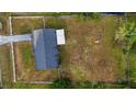 Aerial view of a property showcasing the spacious backyard and the home's layout at 2140 Ne 40Th St, Ocala, FL 34479