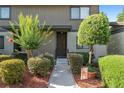 Charming townhome entrance framed by lush landscaping leading to the inviting front door at 3815 Ne 17Th Street Cir, Ocala, FL 34470