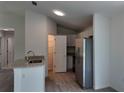 Modern kitchen with stainless steel appliances, granite countertops, and ample cabinet space at 5323 Nw 8Th Pl, Ocala, FL 34482