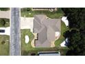 Clean aerial view showcasing the roof, lawn, and landscaping of a single story home at 5340 Nw 26Th Ln, Ocala, FL 34482