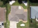 A birds eye view of a single story home showing well maintained roof, lawn, and landscaping at 5340 Nw 26Th Ln, Ocala, FL 34482