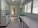 Cozy kitchen with white cabinets, sleek countertops, and modern appliances at 616 Water Rd, Ocala, FL 34472