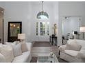 Bright foyer featuring soaring ceilings, a transom window, and stylish decor at 8033 Nw 29Th Street Rd, Ocala, FL 34482