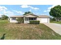 Well-maintained single-story home with attached garage and front yard, ideal for comfortable living at 8375 Sw 109Th Lane Rd, Ocala, FL 34481