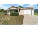 Cozy one-story home featuring an attached garage and well-kept lawn, offering suburban charm and convenience at 8375 Sw 109Th Lane Rd, Ocala, FL 34481