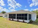 Spacious backyard with large screened enclosure great for relaxing or entertaining at 9029 Se 135Th Loop, Summerfield, FL 34491