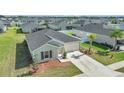 Single-story home featuring a two-car garage, a well-kept lawn, and minimal landscaping at 9266 Sw 58Th Cir, Ocala, FL 34476