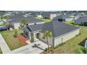 Single-story home featuring a well-kept lawn, minimal landscaping, and a two-car garage at 9266 Sw 58Th Cir, Ocala, FL 34476