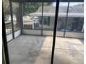 Spacious screened patio providing an outdoor living area to relax and entertain at 1408 Torrey Pines Dr, Lady Lake, FL 32159
