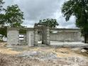 A partially constructed home shows block walls, door and window openings amid a sandy construction site at 15106 Se 94Th Ter, Summerfield, FL 34491