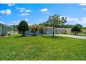 A charming home boasts a verdant lawn and welcoming curb appeal at 16193 Sw 14Th Avenue Rd, Ocala, FL 34473