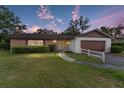Charming single-story home with brick accents and well-maintained landscaping at twilight at 2146 Ne 9Th St, Ocala, FL 34470