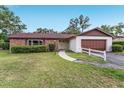 Charming single-story home with brick accents, well-maintained landscaping and two-car garage at 2146 Ne 9Th St, Ocala, FL 34470