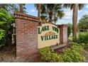 Lake View Village sign with brick pillars and lush greenery, community entrance at 2631 Sw 20Th Cir, Ocala, FL 34471