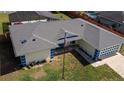 Aerial view of the house showing the roof, lawn, and driveway at 6211 Se 126Th St, Belleview, FL 34420