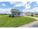 Charming two-story home featuring a well-manicured lawn and a two-car garage with stylish curb appeal at 7536 Sw 60Th St, Ocala, FL 34476