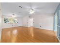 Spacious living room with hardwood floors, ample natural light, and neutral tones at 8463 Sw 108Th Ln, Ocala, FL 34481