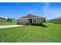 Charming single-story home featuring a well-manicured lawn and attached two-car garage at 8870 Sw 62Nd Ave, Ocala, FL 34476