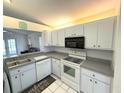Bright kitchen with white cabinets and modern appliances at 2209 Ne 40Th Ave, Ocala, FL 34470