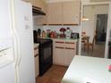 View of the kitchen with an oven, and a fridge at 5391 Nw 19Th Pl, Ocala, FL 34482