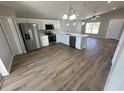 Open-concept kitchen featuring stainless steel appliances and ample counter space at 6638 Se 108Th Ln, Belleview, FL 34420